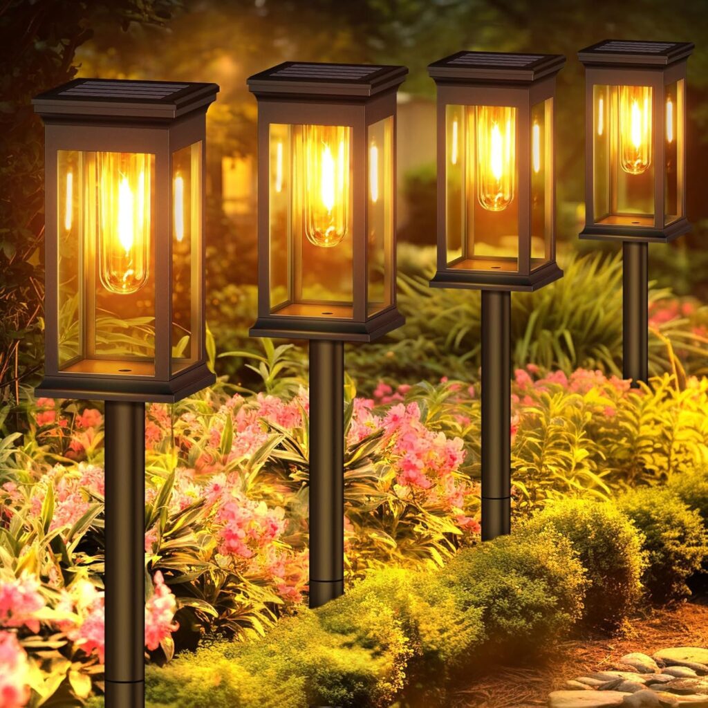 Modern home exterior with various solar lamps illuminating pathways, garden, and patio areas at dusk
